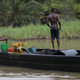 suspected oil thieves ride a wooden boat